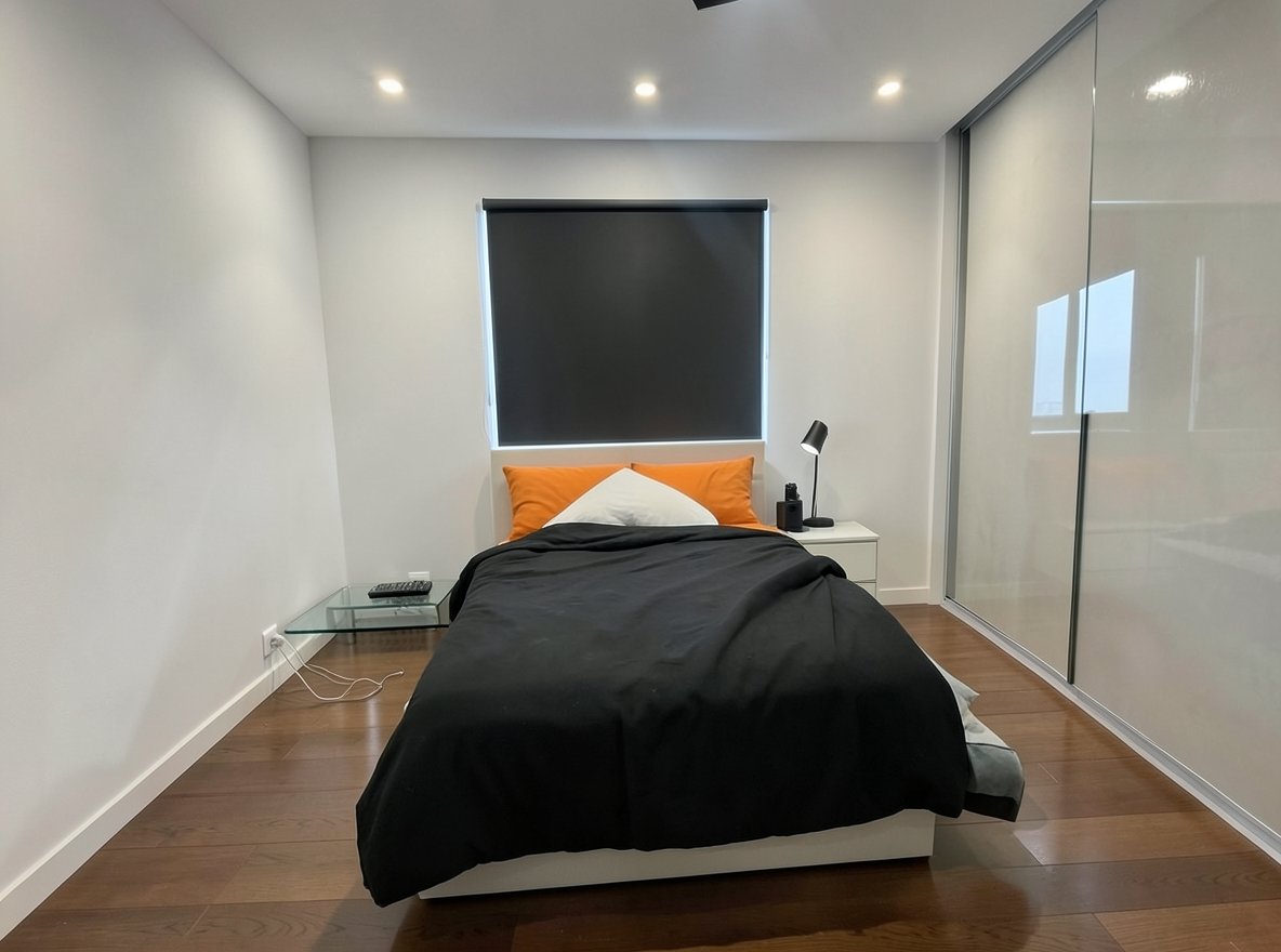 Main redesign studio: Redesign this room in a Modern interior style: clean lines, a neutral palette with bold accents, sleek low-profile furniture, glass and matte-metal su