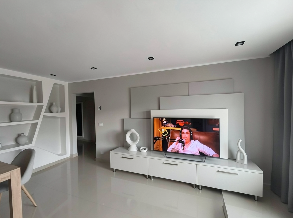 Main redesign studio: Redesign this room in a Minimalist interior style: an uncluttered space, a monochrome neutral palette, a few sculptural pieces, concealed storage, sof