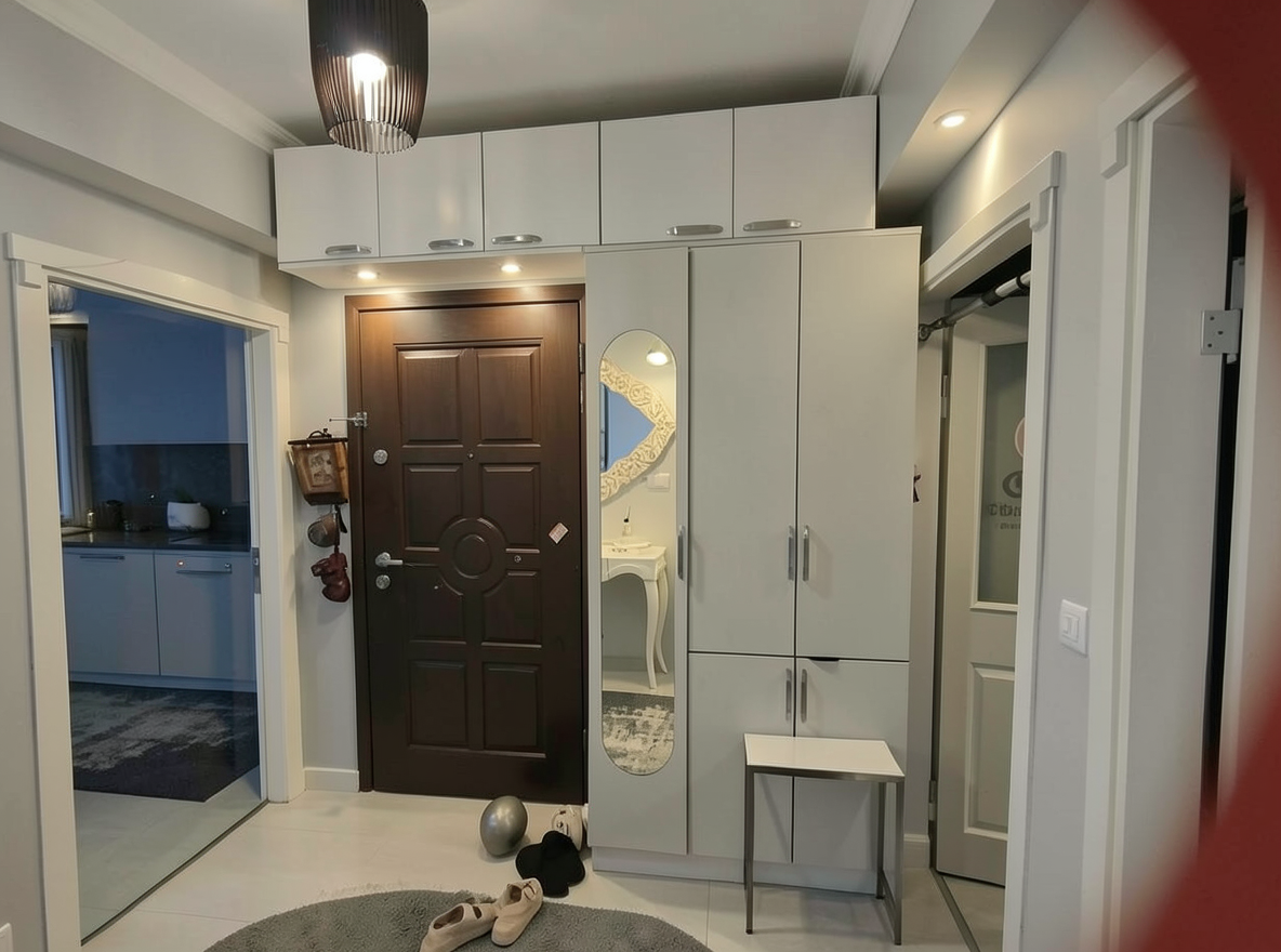Main redesign studio: Redesign this room in a Modern interior style: clean lines, a neutral palette with bold accents, sleek low-profile furniture, glass and matte-metal su