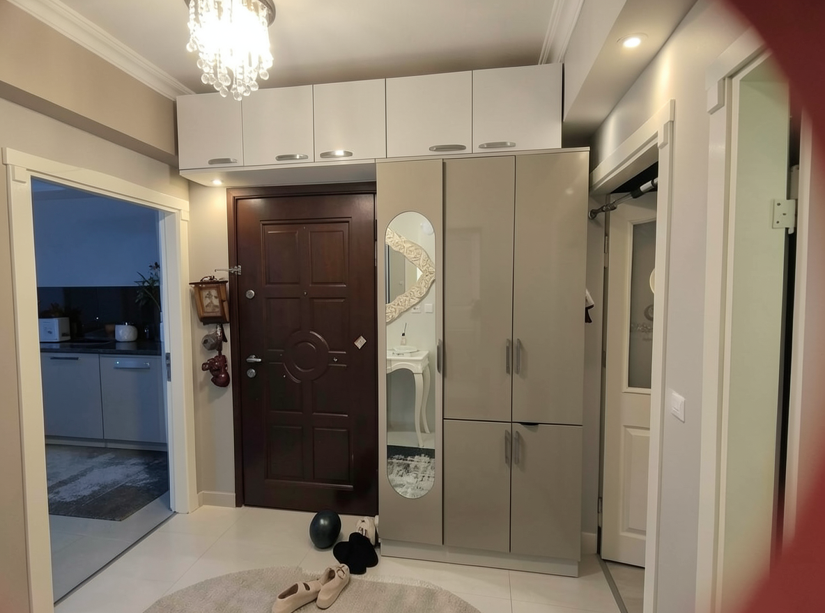 Main redesign studio: Redesign this room in a Modern interior style: clean lines, a neutral palette with bold accents, sleek low-profile furniture, glass and matte-metal su