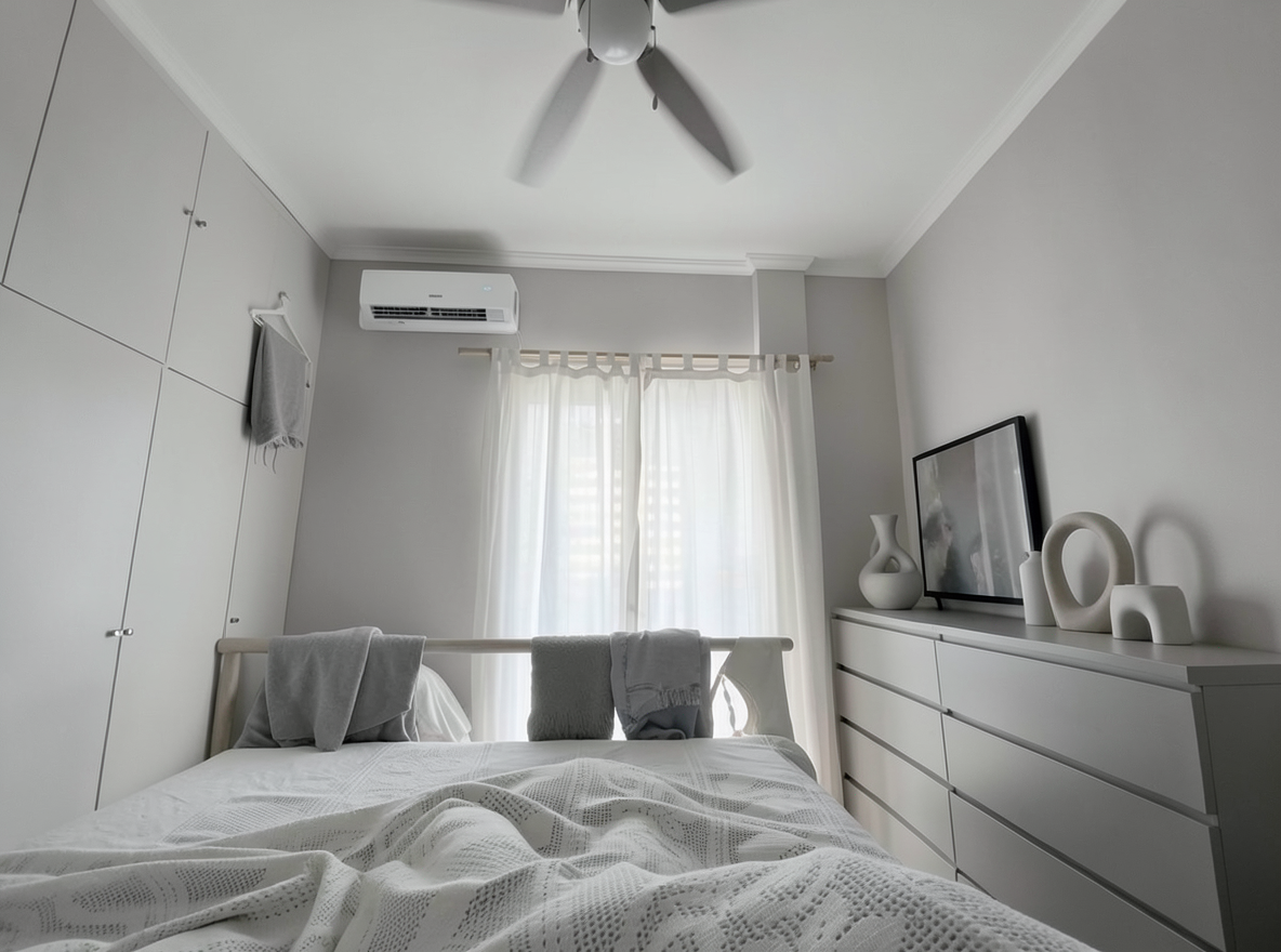 Main redesign studio: Redesign this room in a Minimalist interior style: an uncluttered space, a monochrome neutral palette, a few sculptural pieces, concealed storage, sof