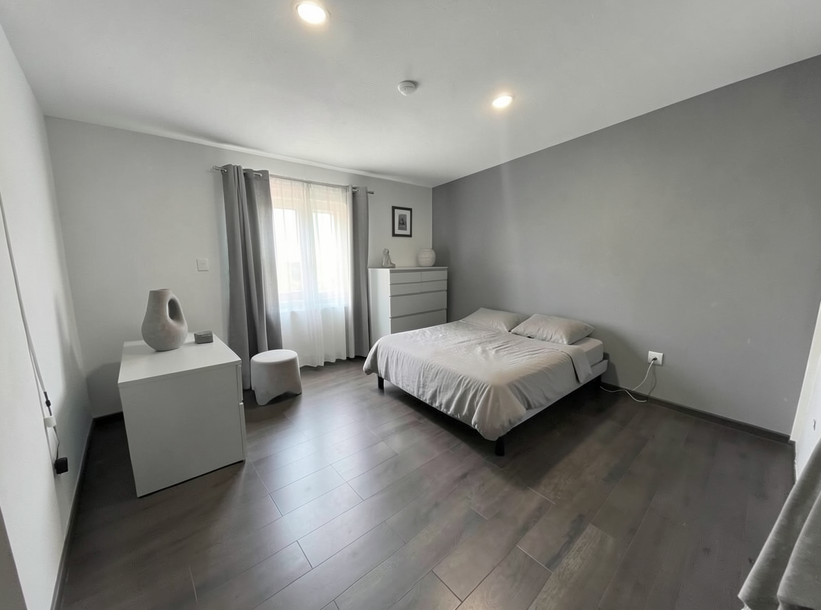 Main redesign studio: Redesign this room in a Minimalist interior style: an uncluttered space, a monochrome neutral palette, a few sculptural pieces, concealed storage, sof