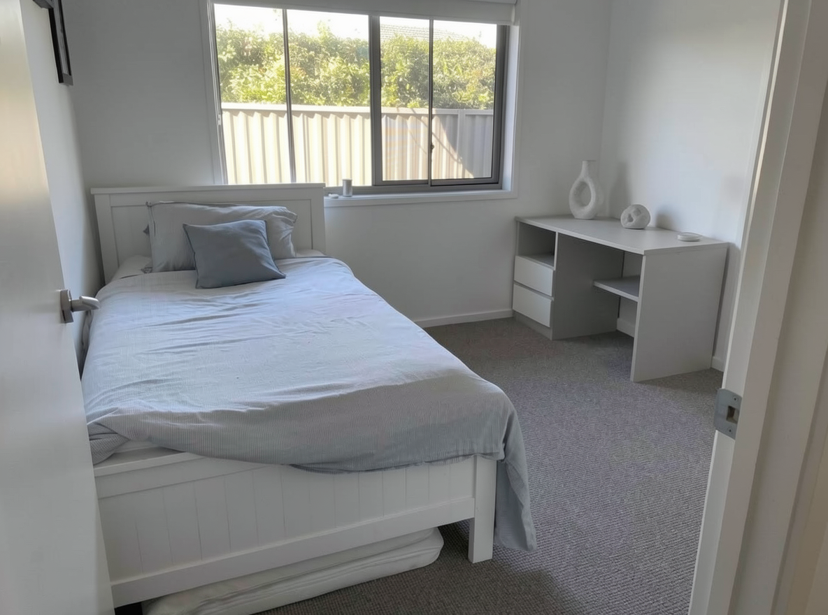 Main redesign studio: Redesign this room in a Minimalist interior style: an uncluttered space, a monochrome neutral palette, a few sculptural pieces, concealed storage, sof