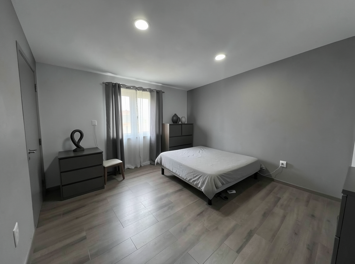 Main redesign studio: Redesign this room in a Minimalist interior style: an uncluttered space, a monochrome neutral palette, a few sculptural pieces, concealed storage, sof